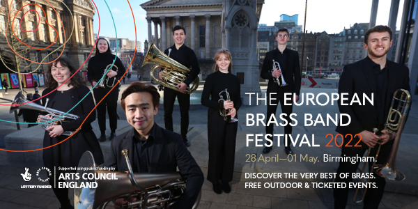 Group of brass students holding instruments standing in front of Birmingham Town Hall