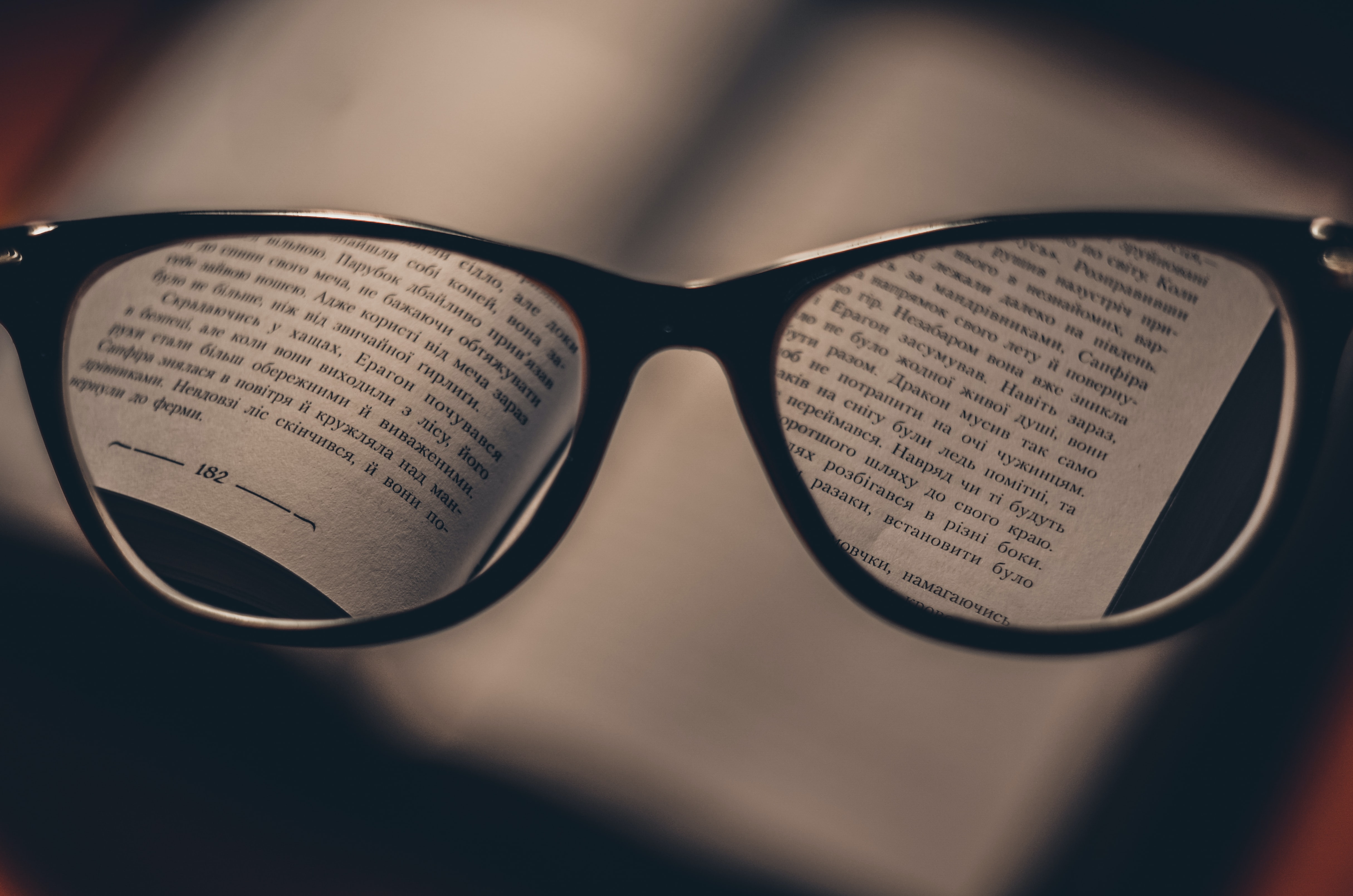 Reading glasses in front of a book