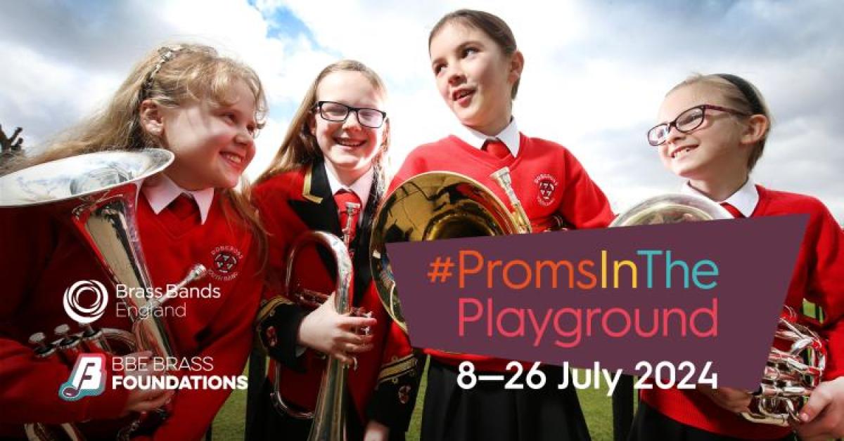 Group of girls in red school uniform, outside holding brass instruments and smiling at each other