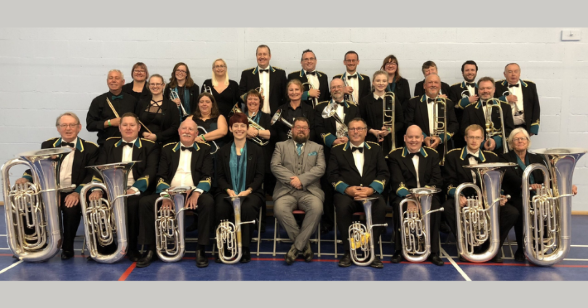 A photo of the full band with their instruments