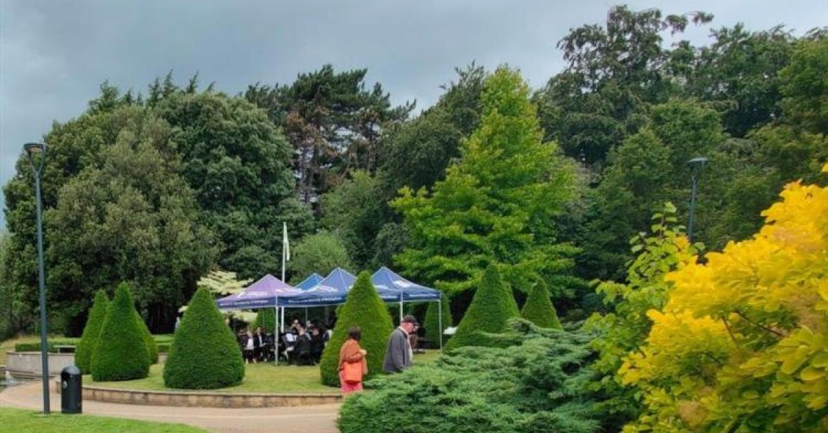 Brass band playing in the millennium gardens of Nottingham University 