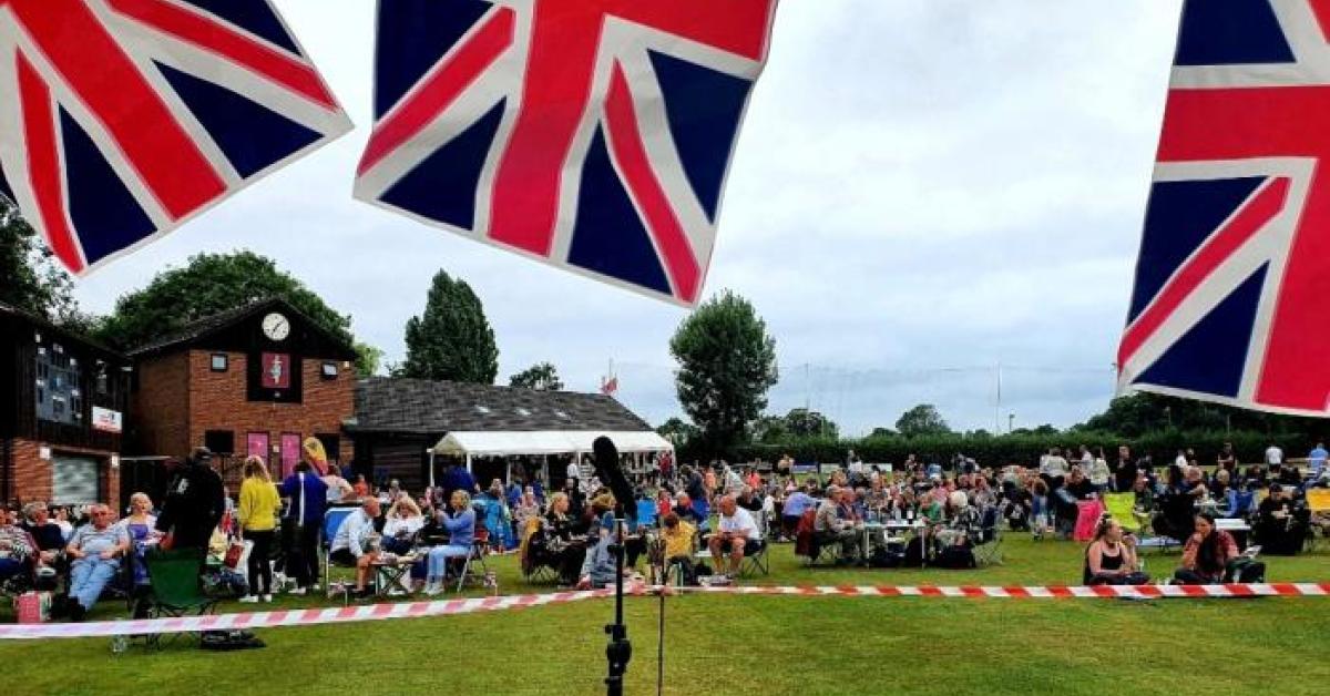 A photo of a cricket pitch with union jack bunting