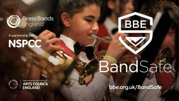 Focus on one child playing a cornet within a band in the centre. BBE logo, in partnership with NSPCC and Arts Council England on the left. BandSafe logo and web address on the right
