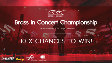 Silhouette of conductor leading a band with a red wash of lighting and text that reads "10 x chances to win!" 