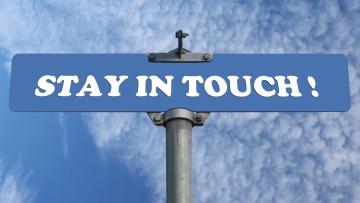 Blue street sign reads 'Stay in touch!'