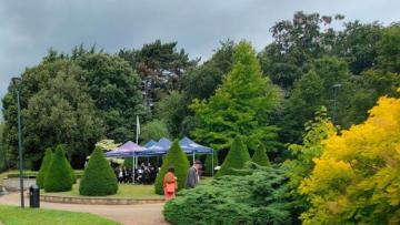 Brass band playing in the millennium gardens of Nottingham University 