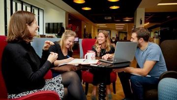 Group of people holding a meeting