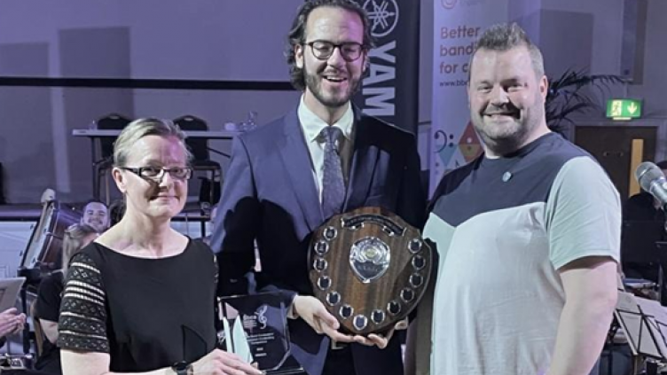 Boris Oppliger receiving Shield from Mareika Gray and James Holt 