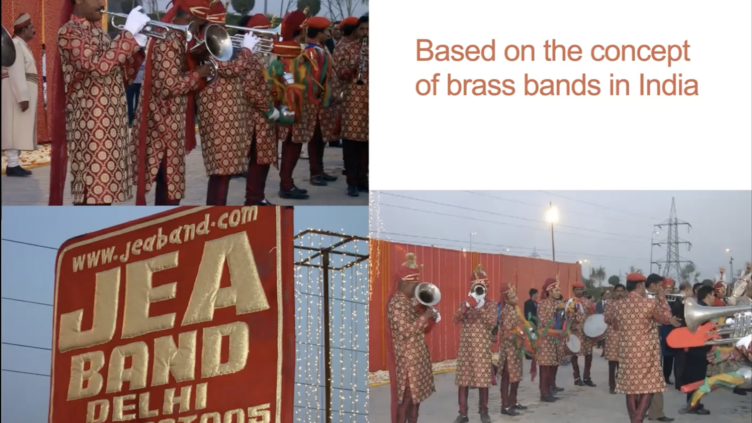 Group of men wearing traditional indian red and gold dress and playing silver brass instruments